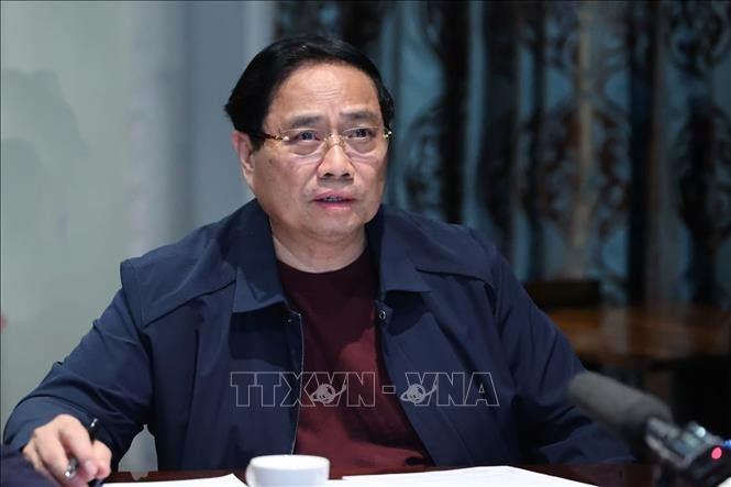 Thủ tướng họp khẩn trực tuyến từ Nam Phi về ứng phó lũ lụt ở miền Trung. Ảnh: Dương Giang/TTXVN