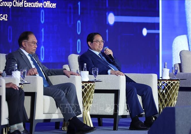 Thủ tướng Phạm Minh Chính phát biểu tại phiên thảo luận “Lưới thông minh kết nối thông qua hợp tác tự chủ AI”. Ảnh: Dương Giang/TTXVN. Thủ tướng Phạm Minh Chính phát biểu tại phiên thảo luận “Lưới thông minh kết nối thông qua hợp tác tự chủ AI”. Ảnh: Dương Giang/TTXVN.