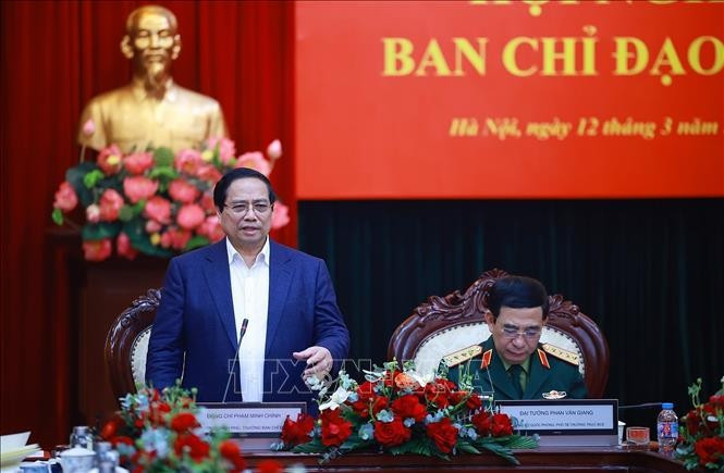 Thủ tướng Phạm Minh Chính làm việc với Bộ Quốc phòng và các bộ, ngành về kết quả hoạt động nghiên cứu, sản xuất, phát triển công nghiệp quốc phòng. Ảnh: Dương Giang/TTXVN