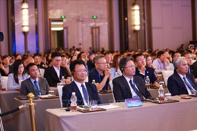 Các đại biểu doanh nghiệp Việt Nam và Trung Quốc tham dự diễn đàn. (Ảnh: Dương Giang/TTXVN) dien-dan5.jpg