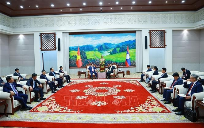 Thủ tướng Phạm Minh Chính hội kiến Tổng Bí thư, Chủ tịch nước Lào Thongloun Sisoulith. Ảnh: Dương Giang/TTXVN