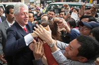 Former US President Bill Clinton is mobbed by well-wishers in Hanoi during his Vietnam visit in 2006. Photo credit: AFP