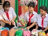 Hội thu heo đất của Trường THCS Lê Quý Đôn (phường Bến Cát). Ảnh: NTCC