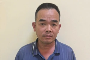 Đinh Văn Long tại cơ quan công an. Ảnh: TG
