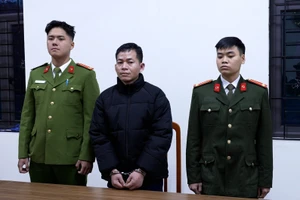 Bị can Trần Quốc Tín tại cơ quan công an.