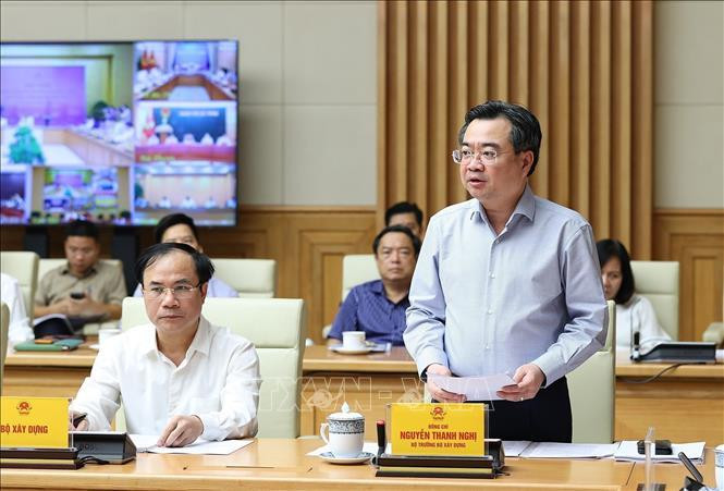 Bộ trưởng Bộ Xây dựng Nguyễn Thanh Nghị báo cáo tình hình thị trường bất động sản. Ảnh: Dương Giang/TTXVN.