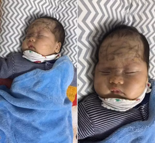 Cậu bé say sưa trong giấc ngủ bị cô chị vẽ chi chít đầy mặt.