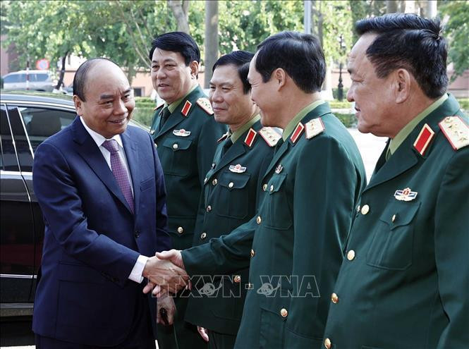 Chủ tịch nước Nguyễn Xuân Phúc và các đồng chí lãnh đạo Bộ Quốc phòng. Ảnh: Thống Nhất/TTXVN. Chủ tịch nước Nguyễn Xuân Phúc và các đồng chí lãnh đạo Bộ Quốc phòng. Ảnh: Thống Nhất/TTXVN.