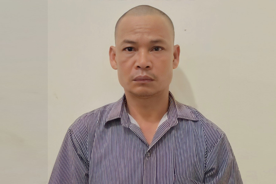 Đối tượng Hà Văn Hợi tại cơ quan điều tra. Ảnh: CANA.