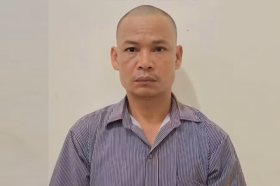 Đối tượng Hà Văn Hợi tại cơ quan điều tra. Ảnh: CANA.