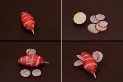 Tiếp theo, khoét 2 vòng tròn nhỏ hai bên vòi ong làm đôi mắt. Cắt củ cải khác thành 4 lát tròn mỏng trong đó có 2 lát tròn nhỏ và 2 lát tròn lớn để làm cánh ong. Dùng dao khứa hai đường ngắn hai bên thân ong, và gắn hai lát củ cải đỏ tròn vào thành đôi cánh con ong. Gắn lát tròn nhỏ bên trên, lát tròn lớn bên dưới tạo hình đôi cánh cho đẹp.