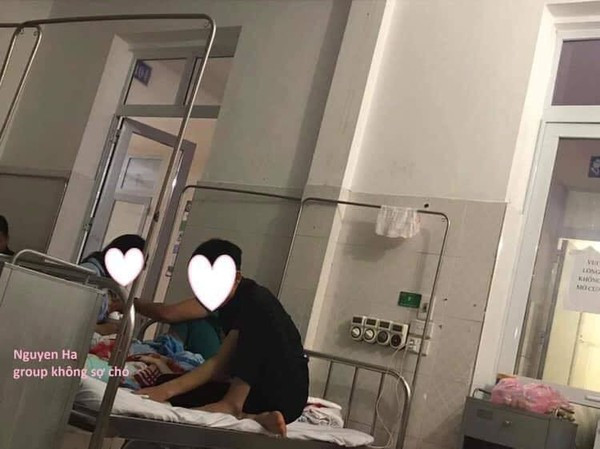 Cảnh ông bố trẻ chăm vợ mới đẻ đầy đáng yêu. Ảnh: Không Sợ Chó