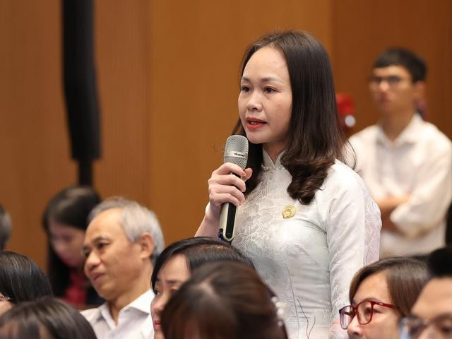 Chị Đỗ Thị Ninh, Trưởng phòng giao dịch 03, Tổ chức Tài chính vi mô TNHH MTV Tình Thương chi nhánh Nghi Lộc, tỉnh Nghệ An - Ảnh: VGP/Nhật Bắc.