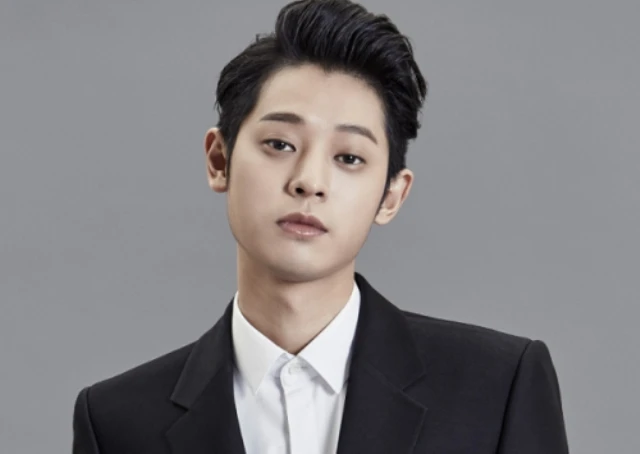 Jung Joon Young bị tố cáo lén quay clip sex và gửi vào phòng chat. Ảnh: SBS.