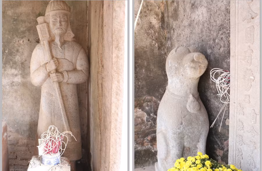 Tượng chó đá và lính canh ở hai bên Cổng đền vẫn còn khá nguyên vẹn.