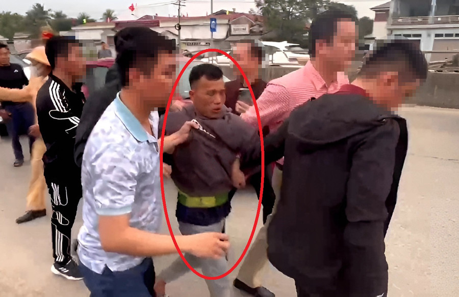 Cơ quan công an bắt giữ Đinh Khương Linh. (Ảnh: CANA)