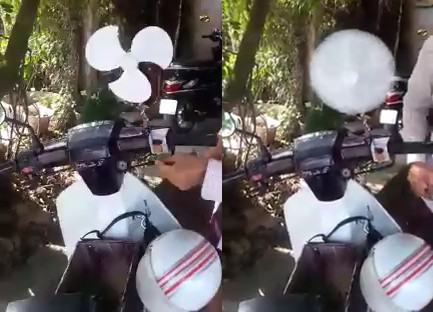 Quạt con cóc được gắn trên tay ga xe máy. nhung-kieu-do-xe-may-chong-nang-nong-chi-co-o-viet-nam