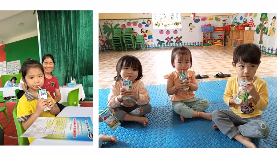Các em nhỏ thưởng thức sữa tiệt trùng Vinamilk ADM bổ dưỡng tại chương trình.