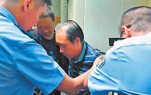 Cao Thừa Dũng bị bắt năm 2016. Ảnh: Beijing Youth Daily.