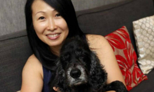Huang và chú chó cưng của mình Huang và chú chó cưng của mình - Ảnh: LianheWanbao
