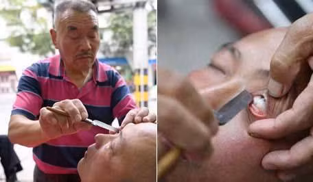 Ông Xiong Gauwu cạo mắt cho khách