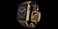 Gold Apple Watch Brilliance Parte Exotic dây da trăn có giá 2.397 Bảng Anh