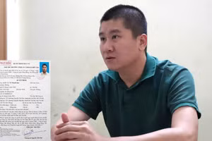 Đối tượng Vũ Thanh Quý và lệnh truy nã. (Ảnh Đỗ Huy)