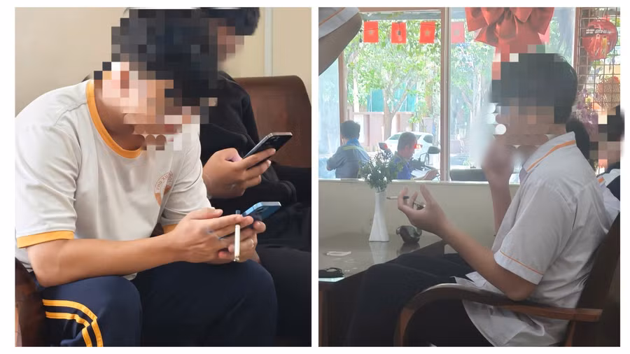 Học sinh mặc đồng phục hút thuốc lá tại một quán cà phê trước cổng trường học. (Ảnh: Thế Hùng)