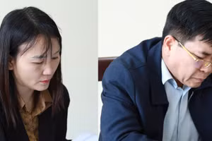 Nguyễn Thị Tú và Trần Quốc Dũng tại cơ quan điều tra. Ảnh: CANA