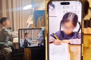 Phụ huynh chia sẻ hình ảnh con đang làm bài tập dưới sự giám sát của hệ thống AI. Ảnh: INT