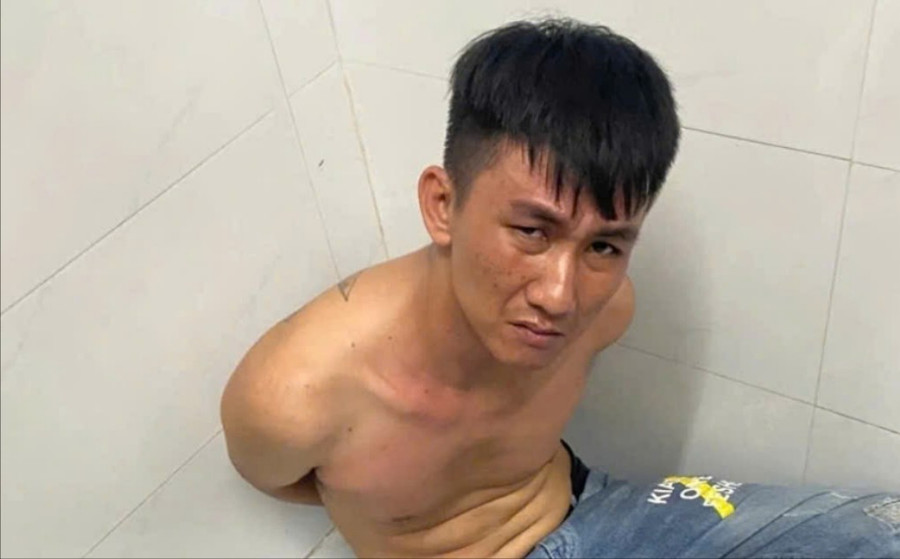 Nguyễn Minh Tâm, nghi phạm đâm tử vong bảo vệ bệnh viện lúc bị bắt giữ.