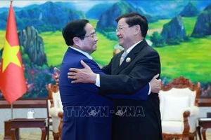 Thủ tướng Phạm Minh Chính hội kiến Tổng Bí thư, Chủ tịch nước Lào Thongloun Sisoulith. Ảnh: Dương Giang/TTXVN