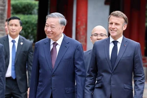 Tổng Bí thư Tô Lâm và Tổng thống Pháp Emmanuel Macron. (Ảnh: Thống Nhất/TTXVN).
