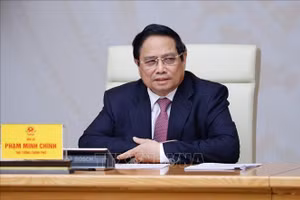 Thủ tướng Phạm Minh Chính chủ trì cuộc họp về cập nhật tình hình và giải pháp ứng phó với chính sách thuế quan của Hoa Kỳ. (Ảnh: Dương Giang/TTXVN)