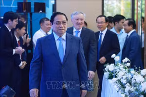 Thủ tướng Phạm Minh Chính đến dự Lễ ra mắt Trung tâm Tài chính quốc tế Việt Nam tại TPHCM. Ảnh: Dương Giang/TTXVN