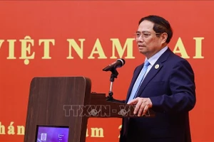 Thủ tướng Phạm Minh Chính phát biểu tại buổi gặp gỡ cộng đồng, lưu học sinh Việt Nam tại khu vực Bắc Kinh, Thiên Tân, Hà Bắc. (Ảnh: Dương Giang/TTXVN)