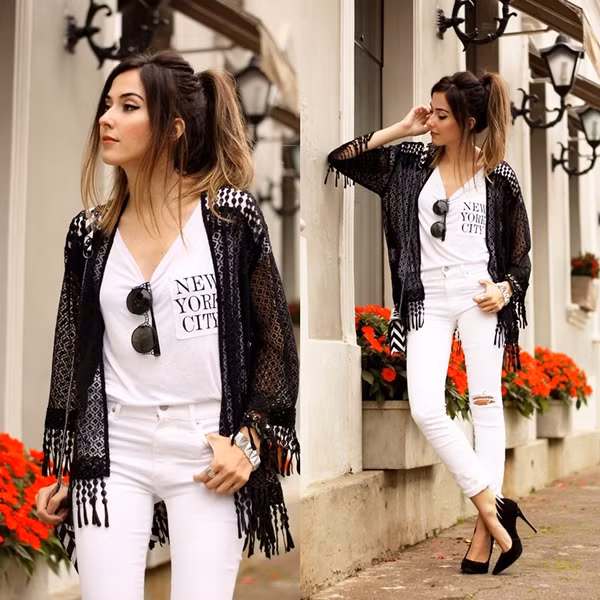 Hot blogger gầy nhẳng Flavia Linden trông đầy đặn hơn khi diện đồ trắng. Cô gái của xứ sở Samba làm gu mặc thêm bay bổng nhờ chiếc áo khoác kimono đính tua rua phóng khoáng. style-cua-cac-blogger-trong-gio-lanh-dau-mua-3
