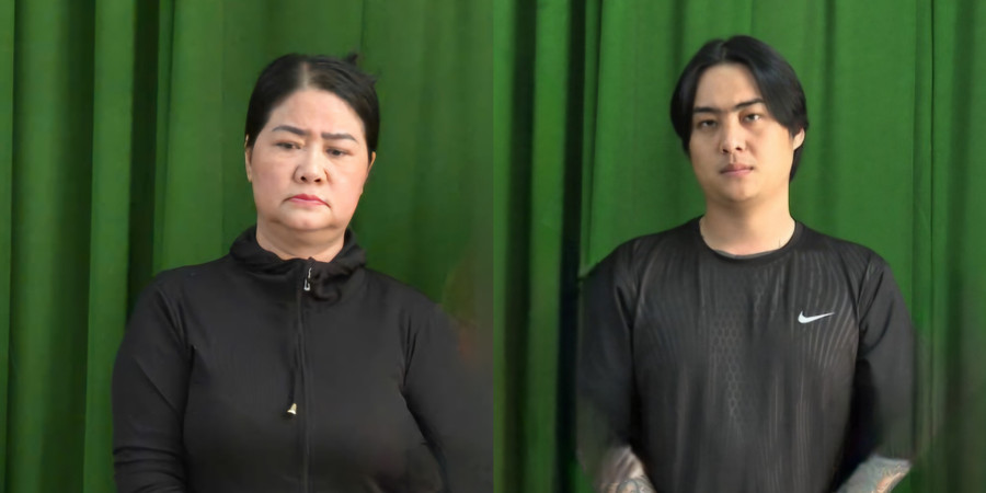 Lâm Thị Thu Em (trái) và con trai Nguyễn Văn Đang tại cơ quan điều tra. (Ảnh: Công an TPHCM)