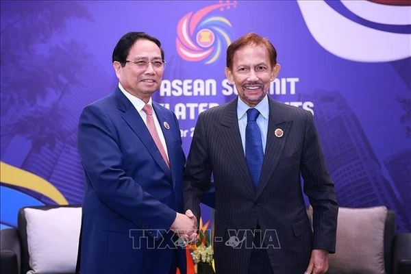 Thủ tướng Phạm Minh Chính gặp Quốc vương Brunei Hassanal Bolkiah. Ảnh: Dương Giang/TTXVN