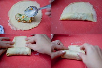 Bắt đầu cuộn nem, bạn đặt 1 tấm vỏ xuống và múc một muỗng canh hỗn hợp trứng và rau củ vào và cuộn lại, phần mép cuối của bánh bạn quét một lớp lòng trắng trứng để vỏ bánh không bị bung ra. Bắt đầu cuộn nem, bạn đặt 1 tấm vỏ xuống và múc một muỗng canh hỗn hợp trứng và rau củ vào và cuộn lại, phần mép cuối của bánh bạn quét một lớp lòng trắng trứng để vỏ bánh không bị bung ra.