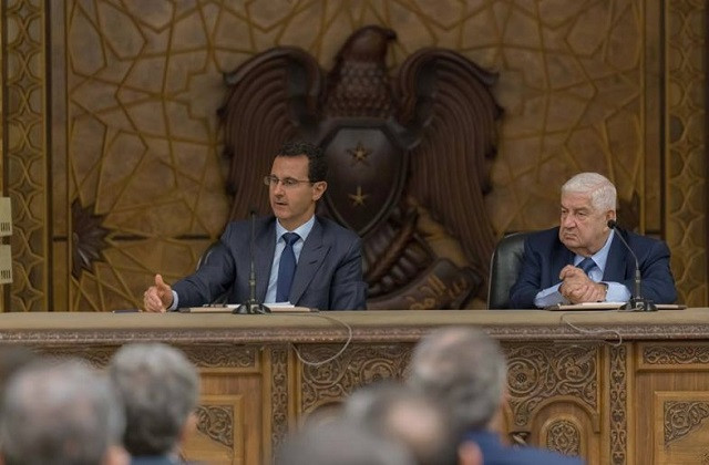 Tổng thống Syria Bashar al Assad (trái)