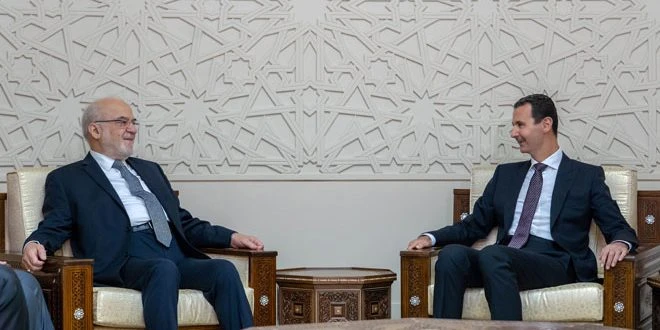 ổng thống Syria Bashar al-Assad (phải) và Bộ trưởng Ngoại giao Iraq Ibrahim al-Jaafari