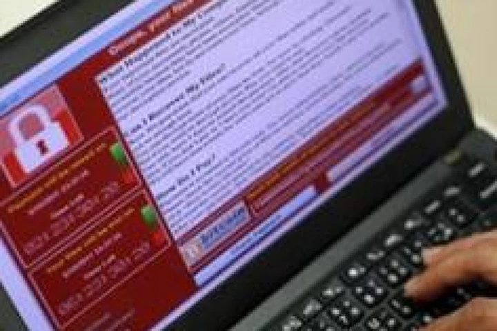 Virus WannaCry hoạt động bằng cách mã hóa các dữ liệu trong máy tính của nạn nhân và yêu cầu nạn nhân phải trả tiền thì mới có thể truy cập dữ liệu trở lại. Ảnh: EPA.