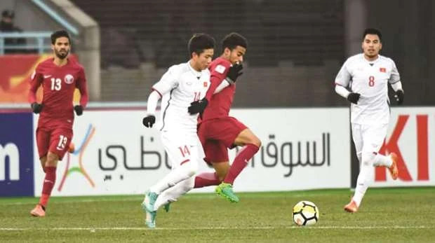 Hình ảnh trận đấu của Giải vô dịch AFC U23 Championship giữa Qatar (áo đỏ) và Việt Nam (áo trắng) vào hôm qua 23/1