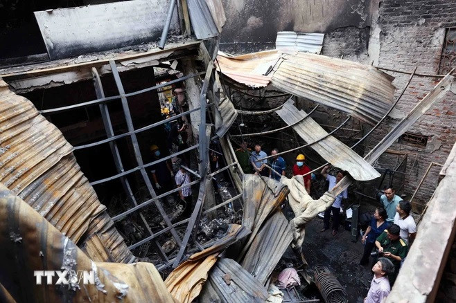 Hiện trường vụ cháy. (Ảnh: Phạm Kiên/TTXVN) Hiện trường vụ cháy. (Ảnh: Phạm Kiên/TTXVN)