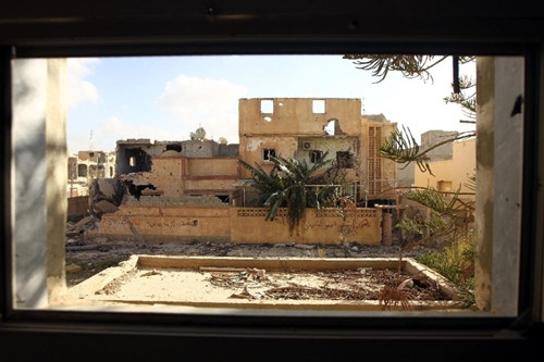 A damaged building is pictured after fighters loyal to Libya