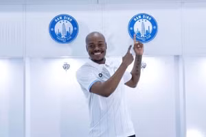 Percy Muzi Tau gia nhập Thép Xanh Nam Định.