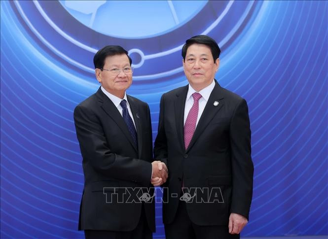 Chủ tịch nước Lương Cường đón Tổng Bí thư, Chủ tịch nước Lào Thongloun Sisoulith dự Lễ mở ký Công ước Hà Nội. Ảnh: TTXVN khai-mac-trong-the-le-mo-ky-cong-uoc-cua-lien-hop-quoc-ve-chong-toi-pham-mang-2.jpg