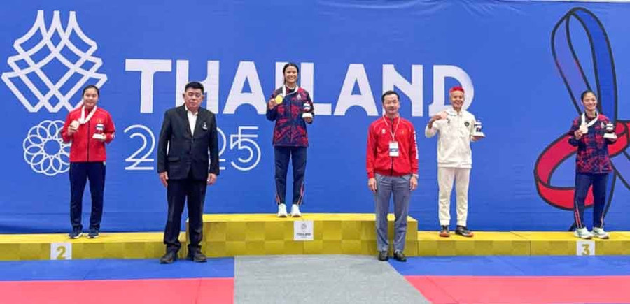 VĐV Phụng Mùi Nhình giành Huy chương Bạc nội dung đối kháng Fighting, hạng cân dưới 52kg nữ tại SEA Games 33. Ảnh: SVHTTVDLCB