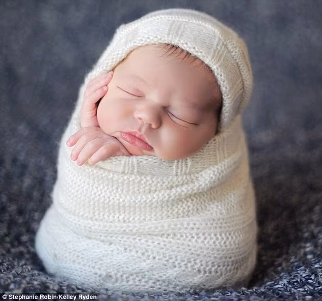 It’s a wrap: Lulled to sleep with a swaddling song Read more: http://www.dailymail.co.uk/news/article-1251841/The-incredible-pictures-snoozing-newborns-taken-babies-10-days-old.html#ixzz0frLA6tAx
